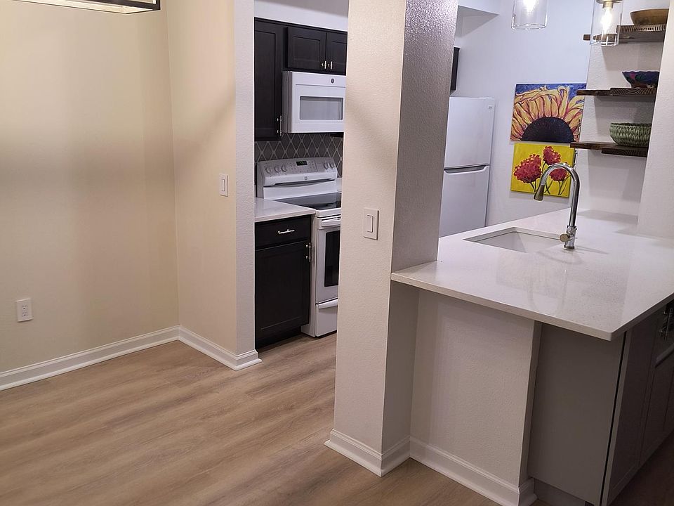 Dining area. Open floor plan to kitchen and living area.