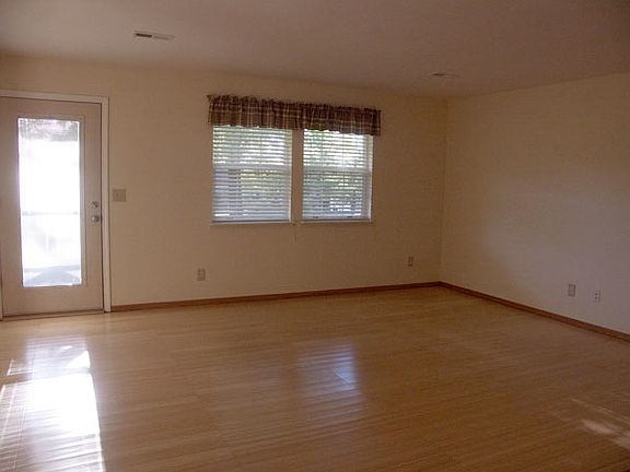 Open, airy living room with plenty of room.