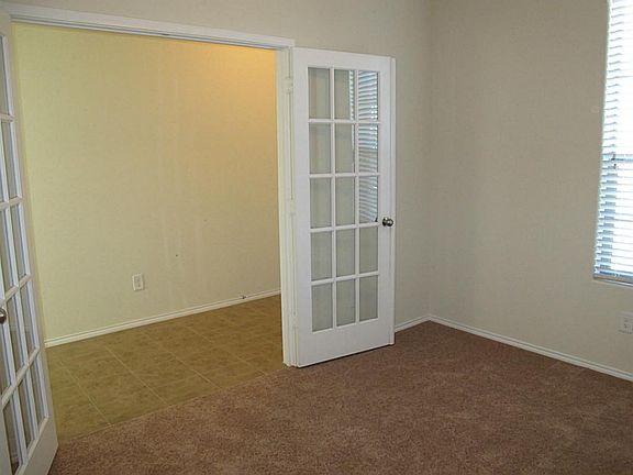 Privately located study with French doors! Perfect for home office or flex room!