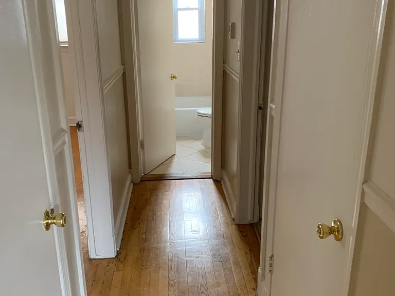 Upstairs hall (master bedroom on the left, full bathroom in the middle, second bedroom on the right) with two closest