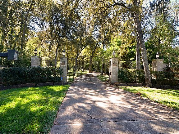 Tucked at the quiet end of a secluded Cul-de-Sac, is the key pad activated electric gate that offers both distinction and privacy