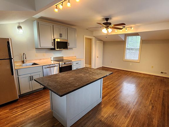 Great room with custom kitchen and large eat-at island.