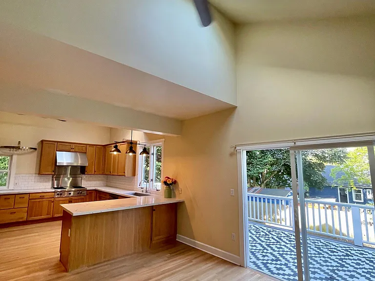 Soaring ceilings and skylights in the combined kitchen and family room