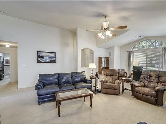 Arched windows and openings plus ceiling details add to the architectural interest here....