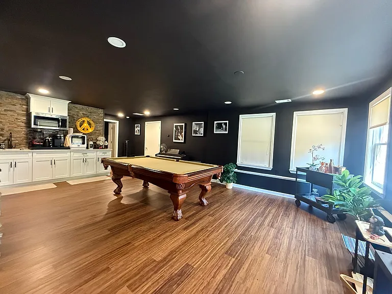 Basement Entertainment Area with Theater and Kitchen