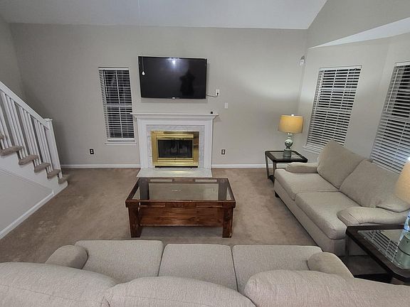 Fully furnished common room living area with mounted 55in samsung smart tv
Fire place not in use
