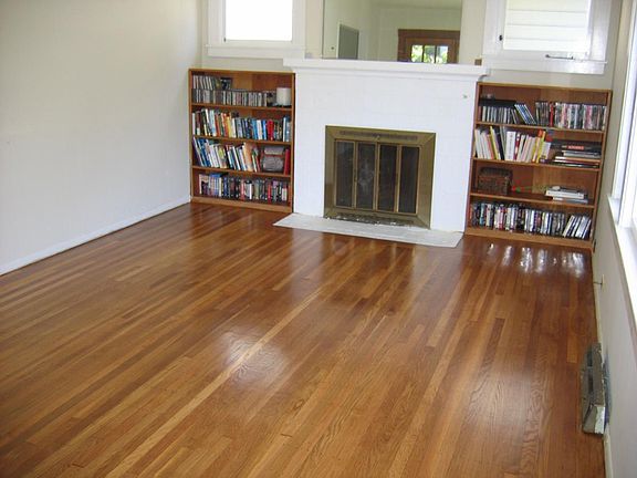 Living room with fireplace and built in shelves