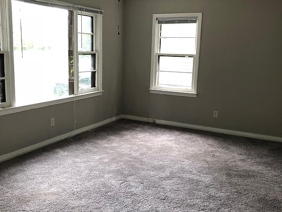 living room - updated light fixtures and new carpets