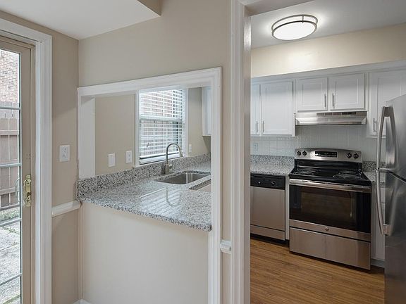 Stainless steel appliances and granite countertops in the ki