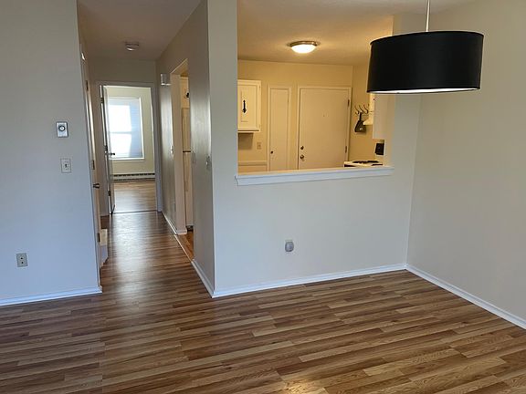 98 Wellington; View to Dinninig area, kitchen. A Corridor with 2 closets brings you to bathroom and two Bedrooms.