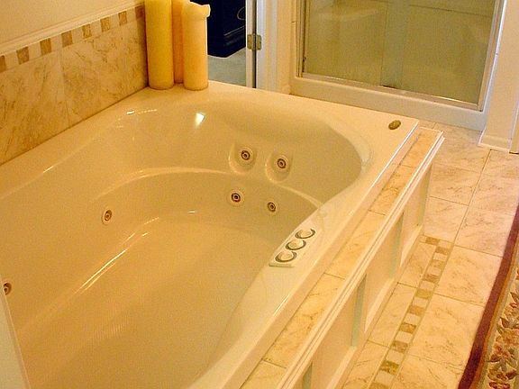 Tumbled Marble Whirlpool Master Bath