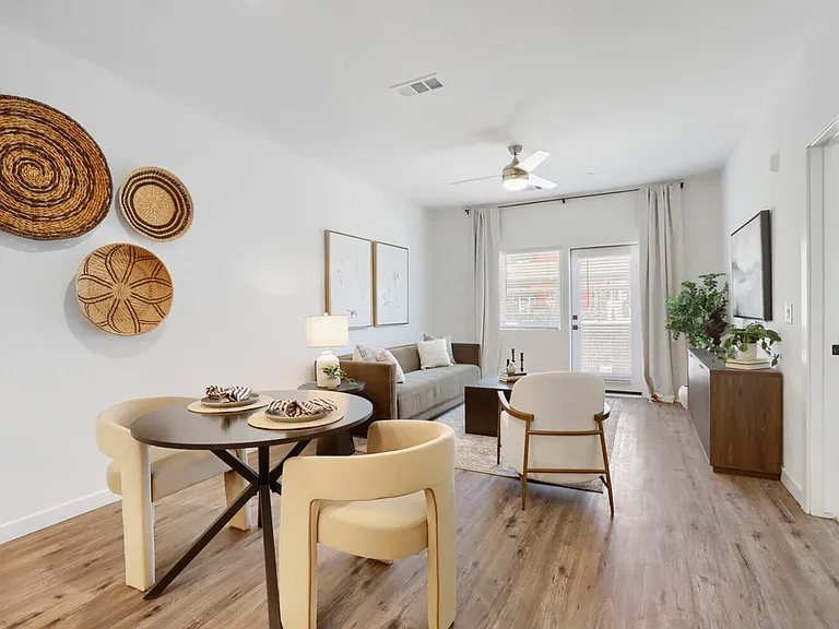 Open living, your way. The B2 floor plan seamlessly connects your dining and living spaces, with wood-look flooring, a ceiling fan, and sliding patio doors that bring in natural Arizona light.
