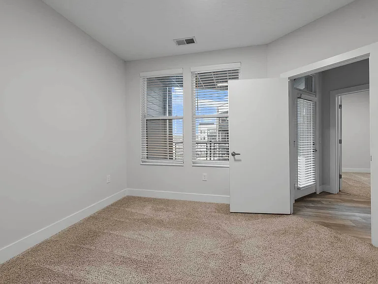 Enjoy a spa-inspired bathroom with a granite-top vanity, ample lighting, and a full tub _ offering a blend of luxury and practicality in your Clintonville home. Enjoy a spa-inspired bathroom with a granite-top vanity, ample lighting, and a full tub _ offe