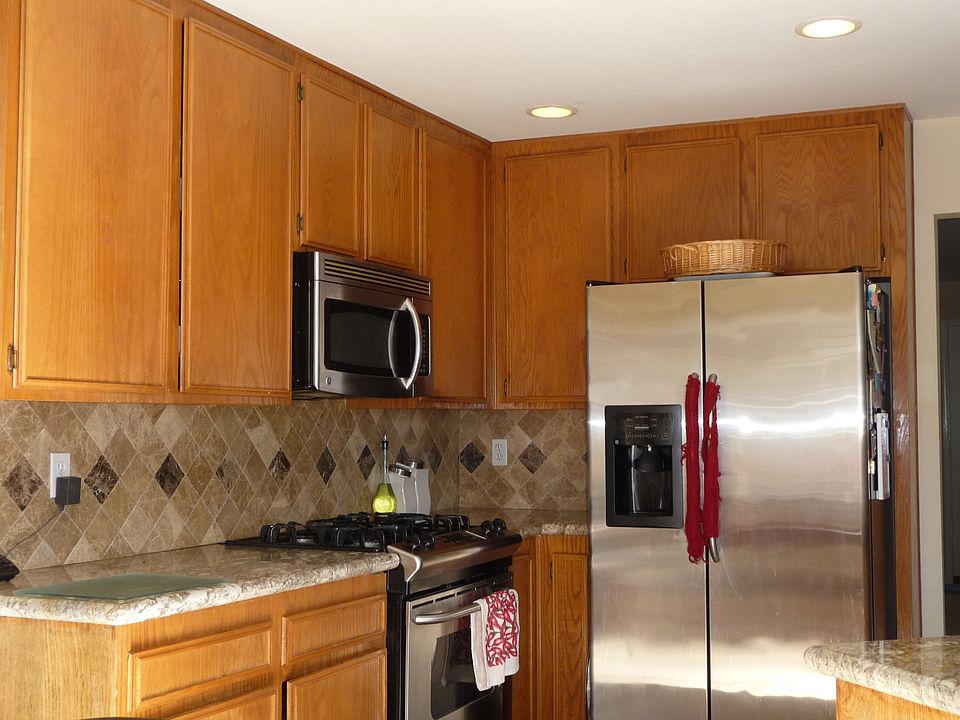 Kitchen with granite countertops and marble (emperador) backsplash