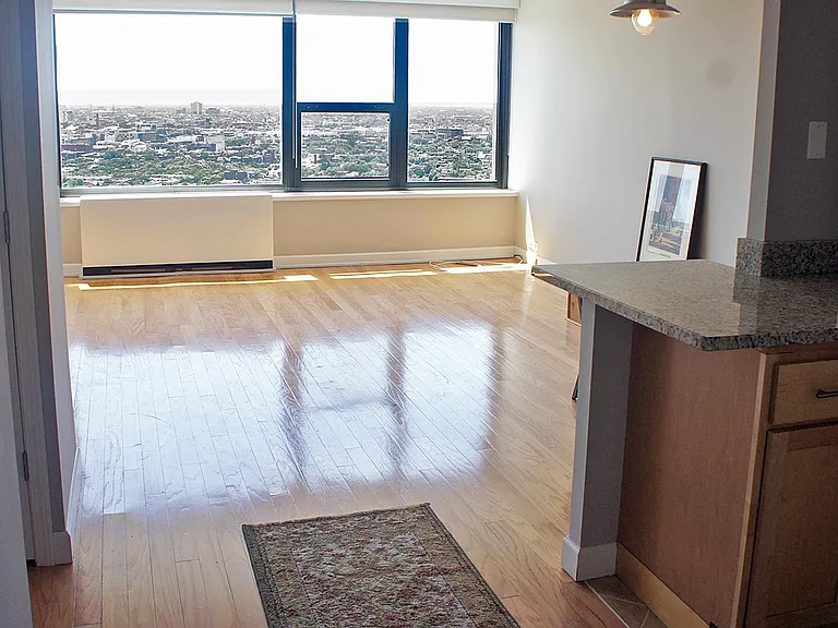 Main living space and granite-topped kitchen island.