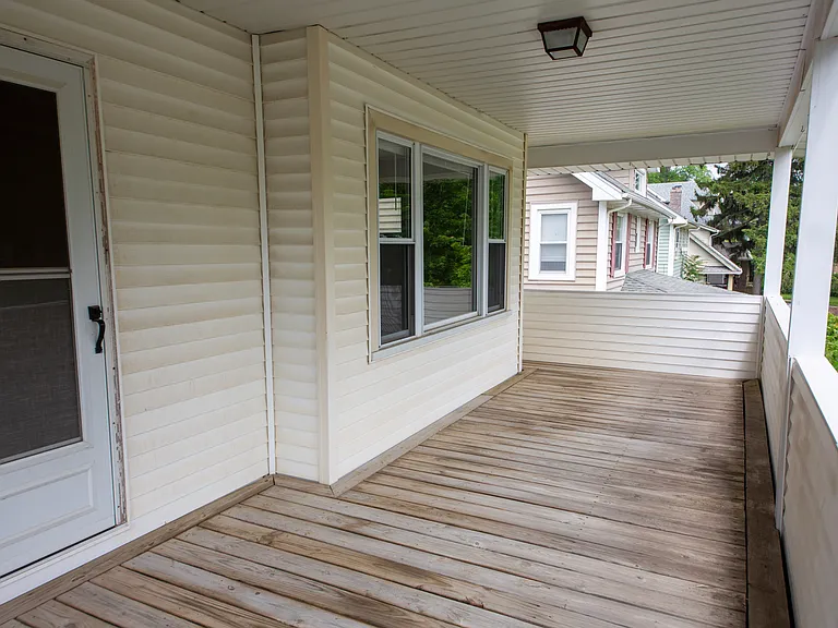 Rare oversized upper-level porch offering additional outdoor living and entertaining space.