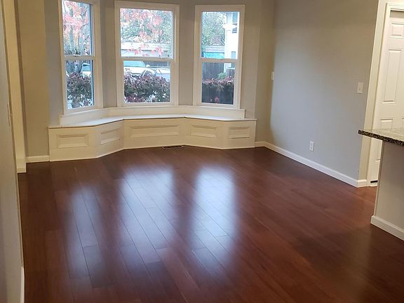 Dining room with built ins and bay windows