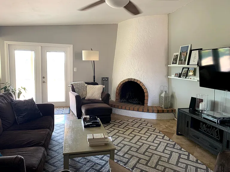 Family room with wood burning fireplace