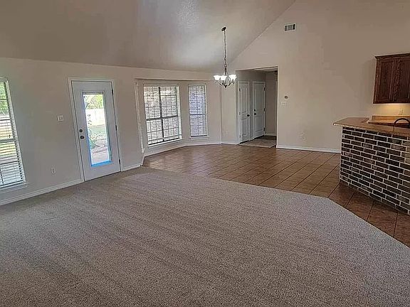 Open concept living, dining, and kitchen area