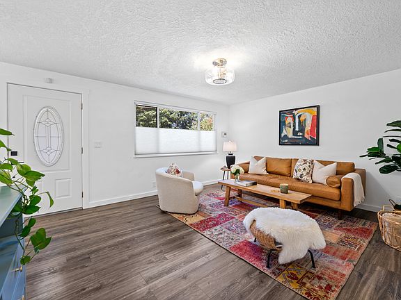 Living room and front entrance, equipped with smart lock.