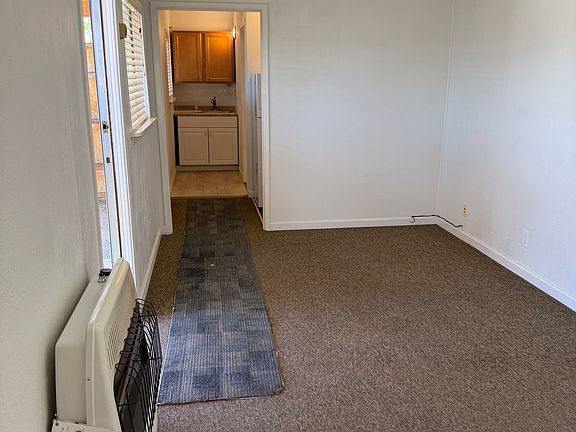 Living room looking towards the kitchen and bathroom