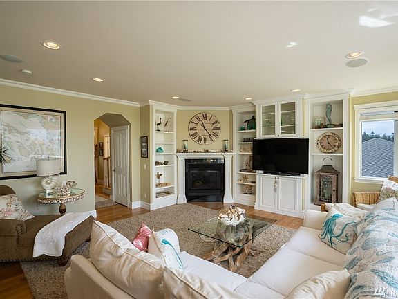 Front entry, powder room to the left. Formal Dining to the right, custom stairs to upper level. 