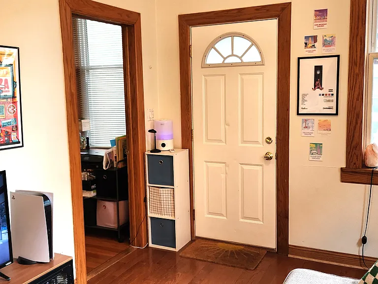 Small bedroom/office open entrance and closed rear door (east side of building)