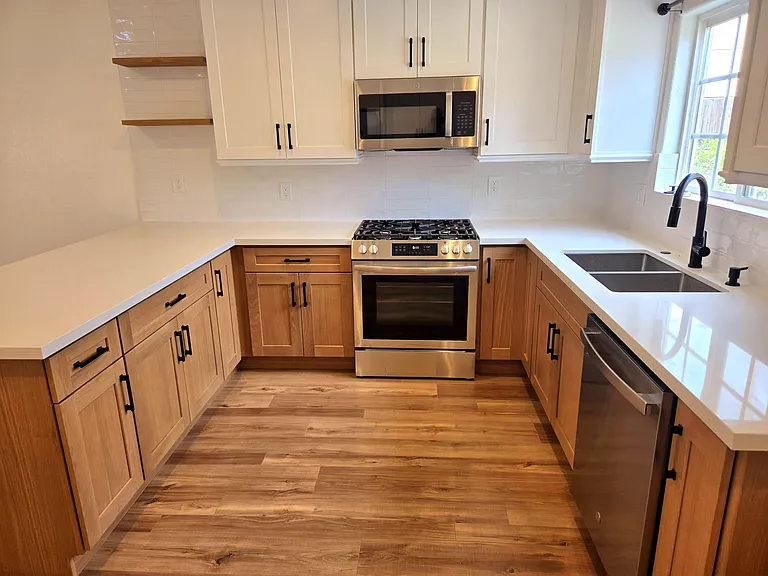 Completely remodeled kitchen with new cabinets, new countertops, new refrigerator, new stove / range, new microwave, new dishwasher, new sink, new faucet. Everything is NEW and Clean !