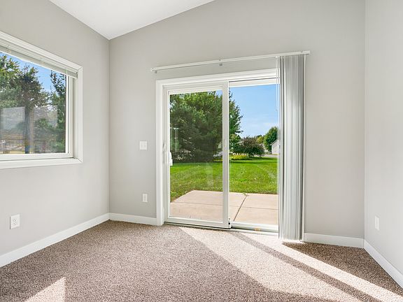 The Sunroom Opening To A Patio For Grilling & Entertaining.