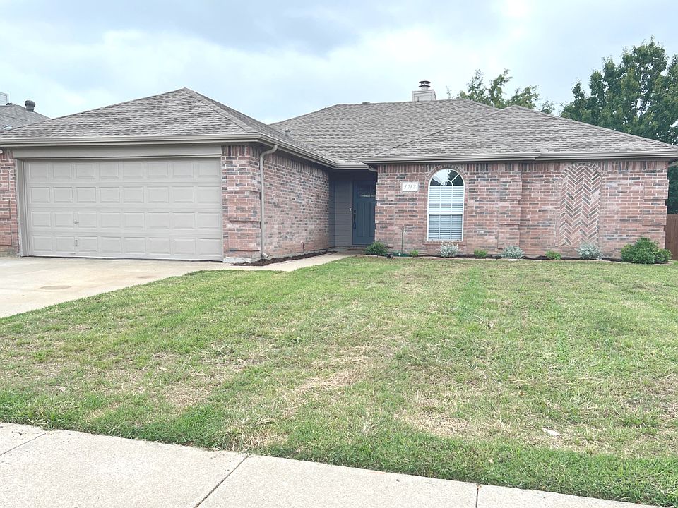 Front exterior with two car garage