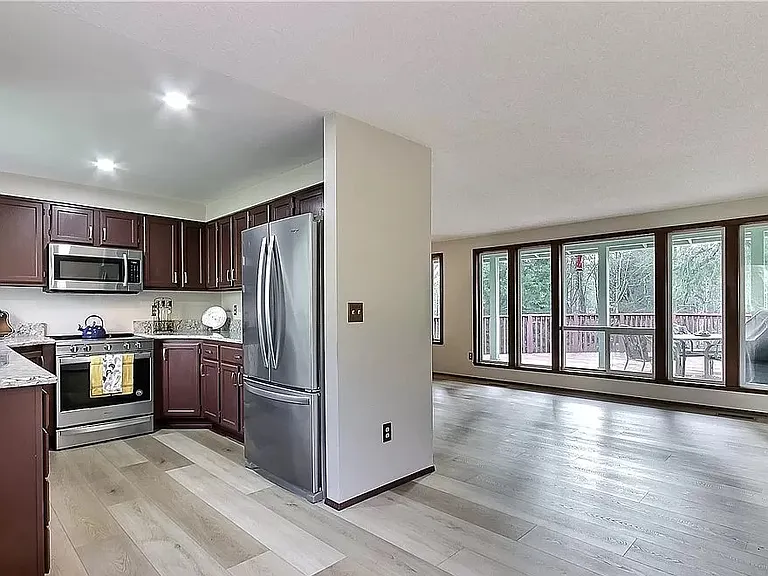 Dining room and kitchen areas.