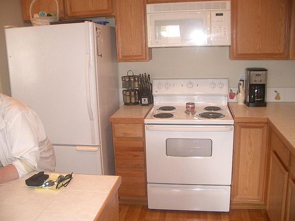 Kitchen appliances: refrigerator, stove, microwave
