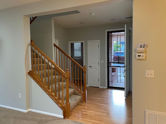 Front door, closets, downstairs bathroom and staircase to upstairs bedrooms.
