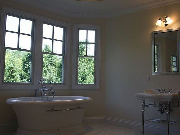 Relaxing en-suite Master Bathroom adjacent to walk-in-closets! 
