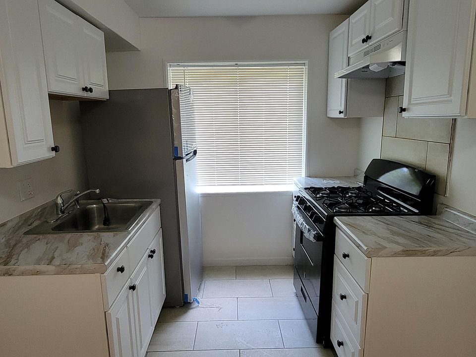 Updated kitchen with new cabinets, counters, stove and refrigerator!