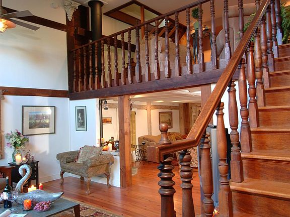 Living room and stairs to loft, second bedroom