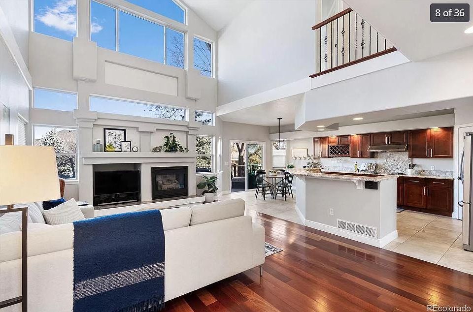 Vaulted ceilings on the main floor with floor to ceiling windows in the front and back sitting rooms
