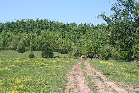 Entrance road to east side of prop. on Baker Rd. side.