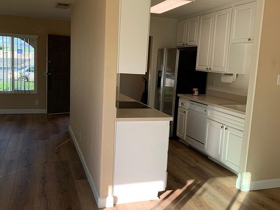 Sunlight from sliding door to Backyard onto the Galley Kitchen.