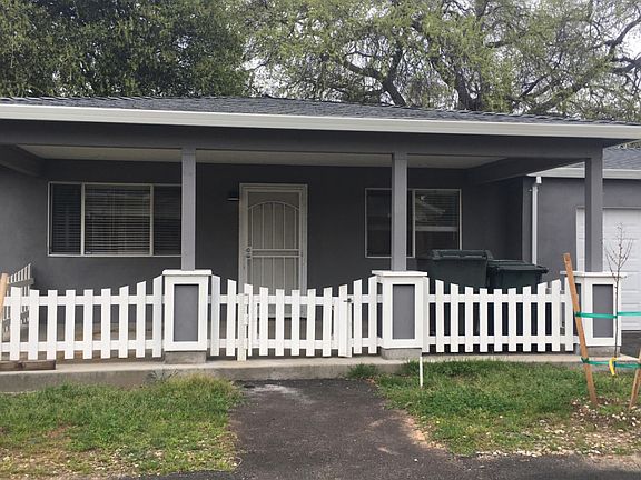 Shaded front porch with canned lights.