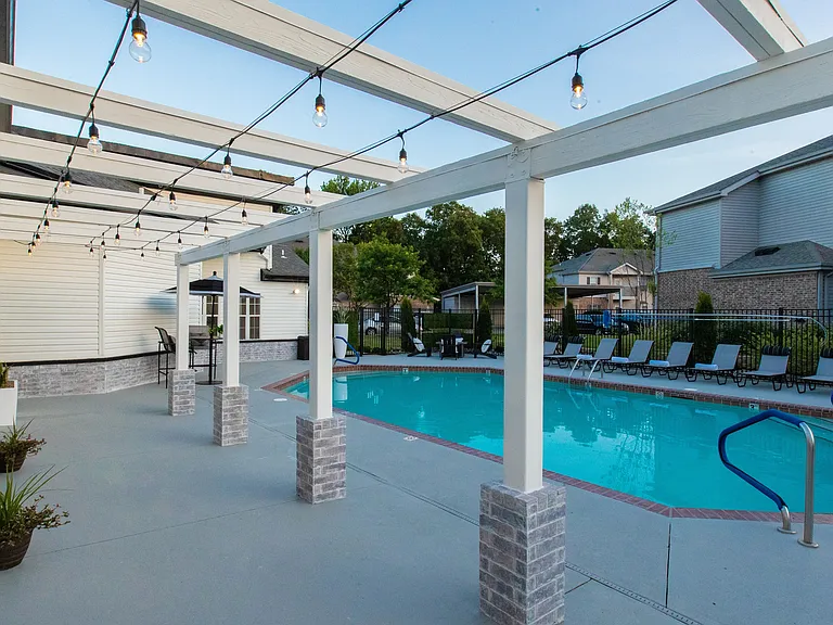 Experience the allure of bistro lighting by the pool after dusk, casting a romantic glow and setting the stage for a magical nighttime ambiance.