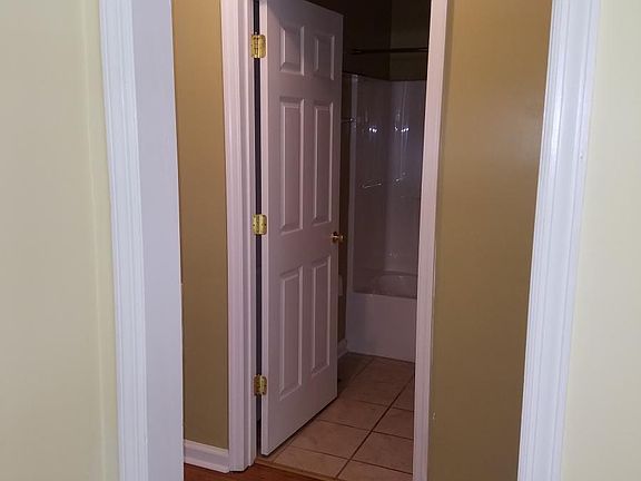 View of hall way and entrance to the bathroom from the livin