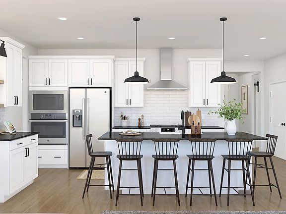 Kitchen with pendant lighting and floating shelves