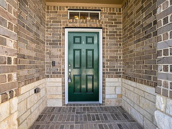 A desirable feature is the covered front porch area that leads into the home.