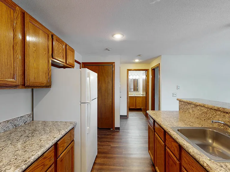 Granite like custom counter tops with breakfast bar.