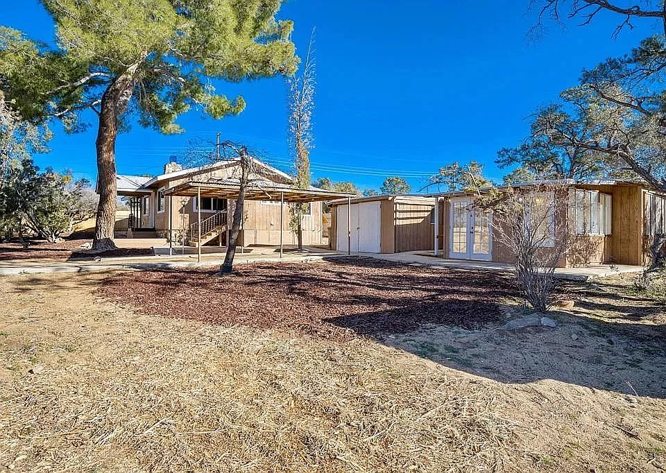 Landscape, main house, garage, and casita.