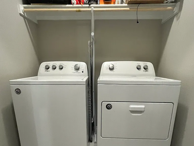 Washer and Dryer in hallway. Xtra storage too.