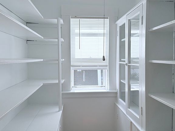 Bright and Large walk-in Kitchen Pantry with Door.
