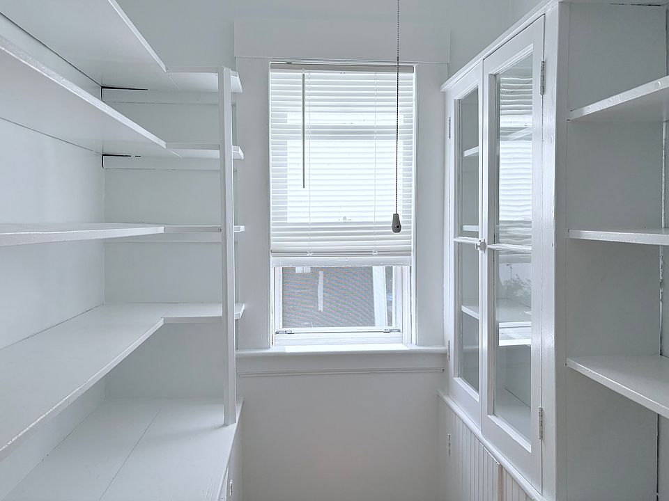 Bright and Large walk-in Kitchen Pantry with Door.