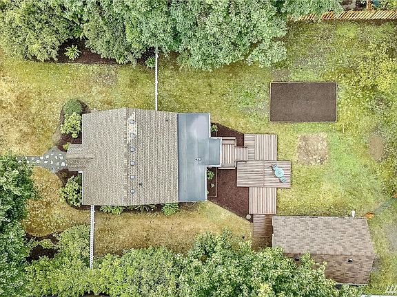 Top view with new fencing and raised garden bed. 